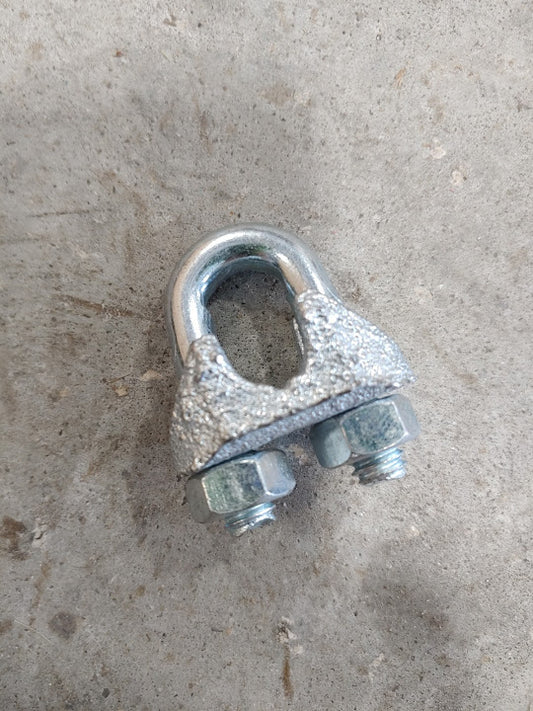 A close up of an old metal clamp